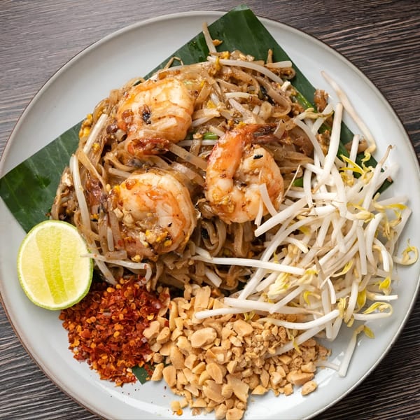 Soi21 Asian Bistro & Bar's Pad Thai with shrimp, bean sprouts, peanuts, chili flakes, and lime.